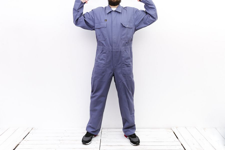man in coveralls at a casual event