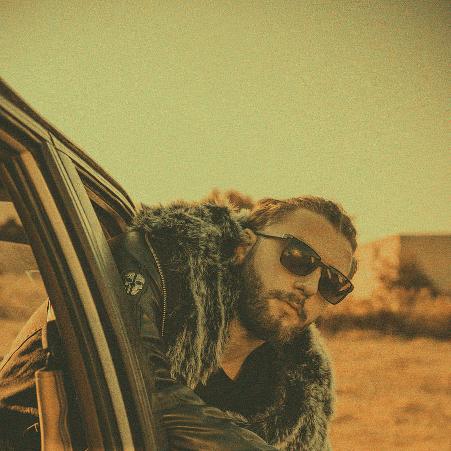 Fashionable man wearing stylish coveralls