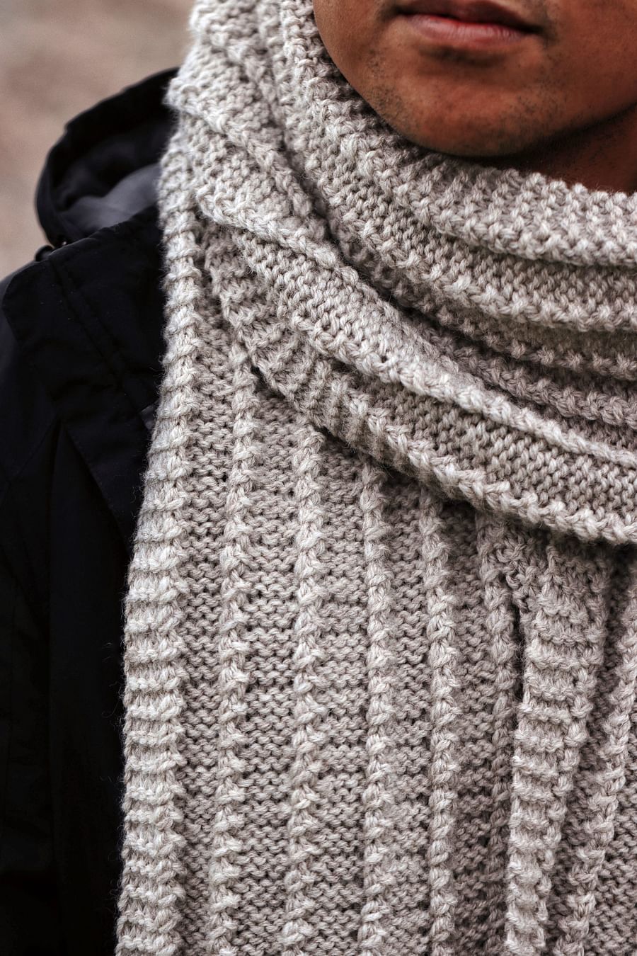 man wearing a chunky knit scarf